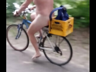 A daring nudist pedals a rain-soaked bike trail, helmeted and barefoot, her unclothed body exposed to the public. This thrilling ride through Des Moines and Polk County is a testament to audacious nudity.