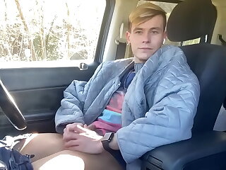 Road trip turns steamy as a young, horny gay boy indulges in public self-pleasure. His expert hand works his shaved cock, creating a thrilling, reality-style solo show.